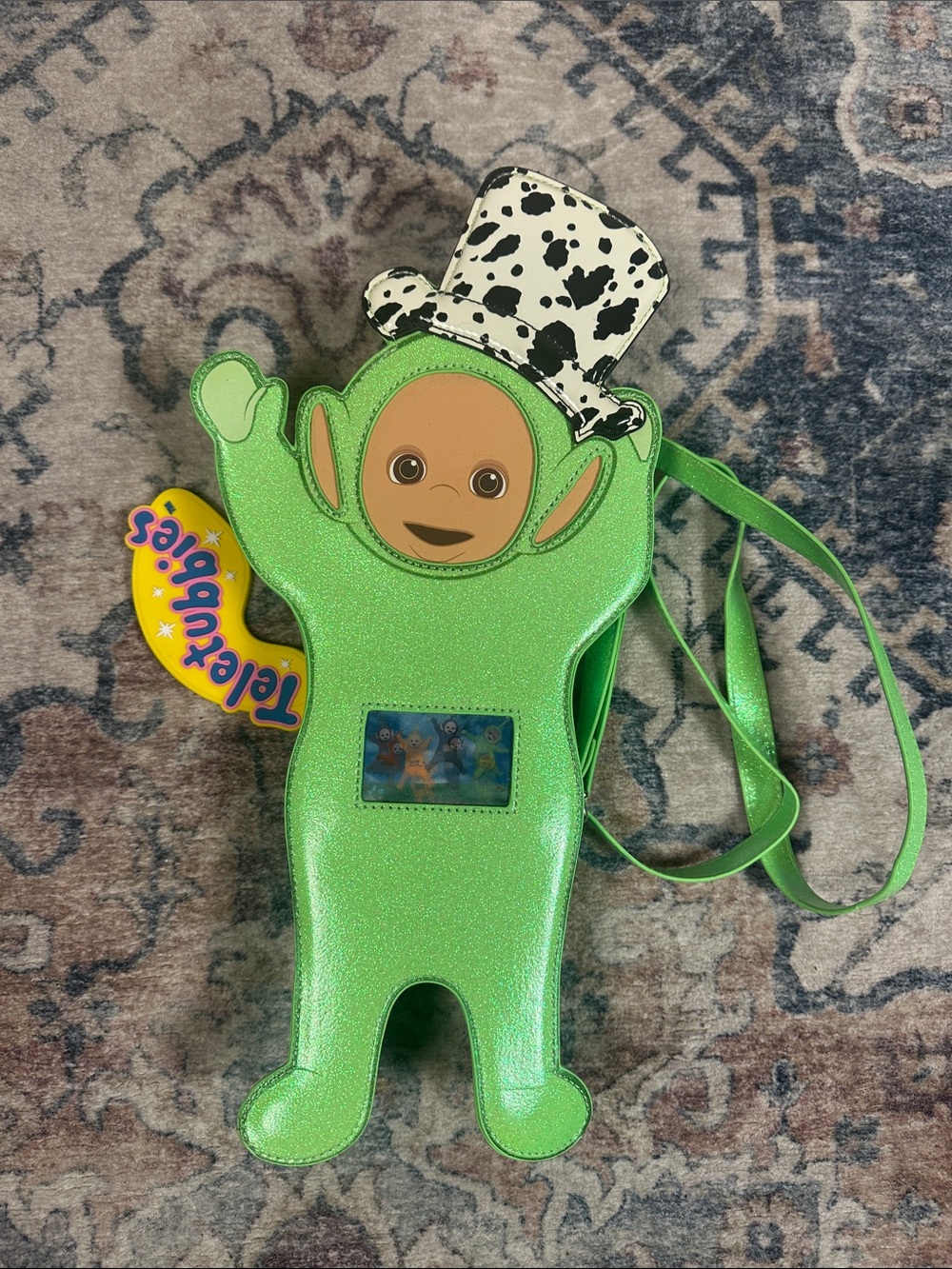 Dolls Kill Green Sparkle Teletubbies Character Crossbody with Cow-Print Hat